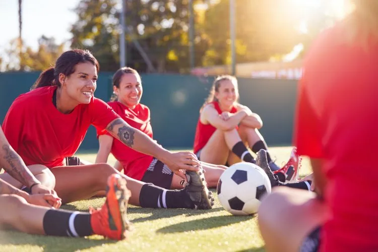 Womens Football Team Stretching